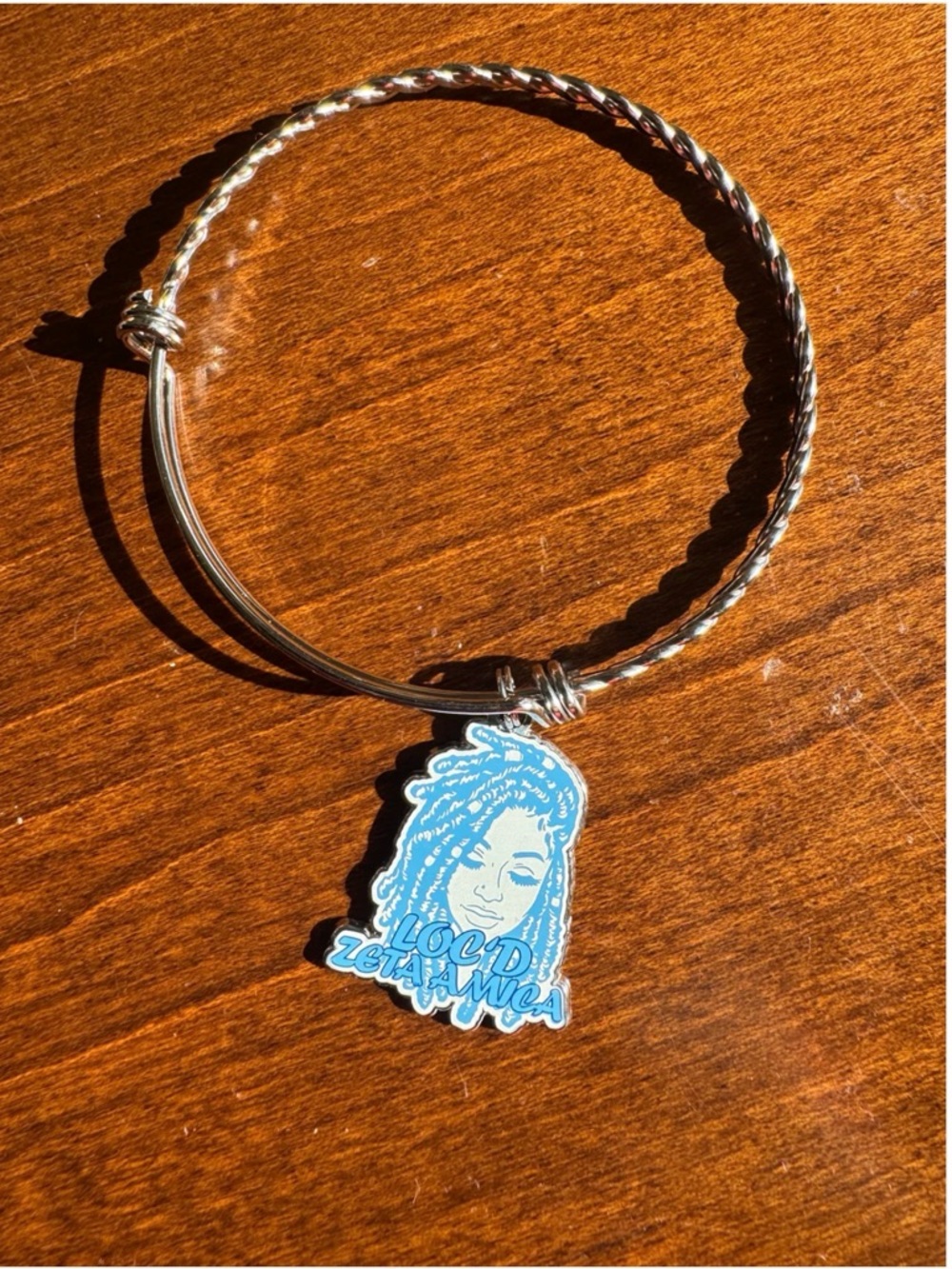 Silver Tone Charm Bracelet with Blue 'Loc'd Zeta Amicae' Charm